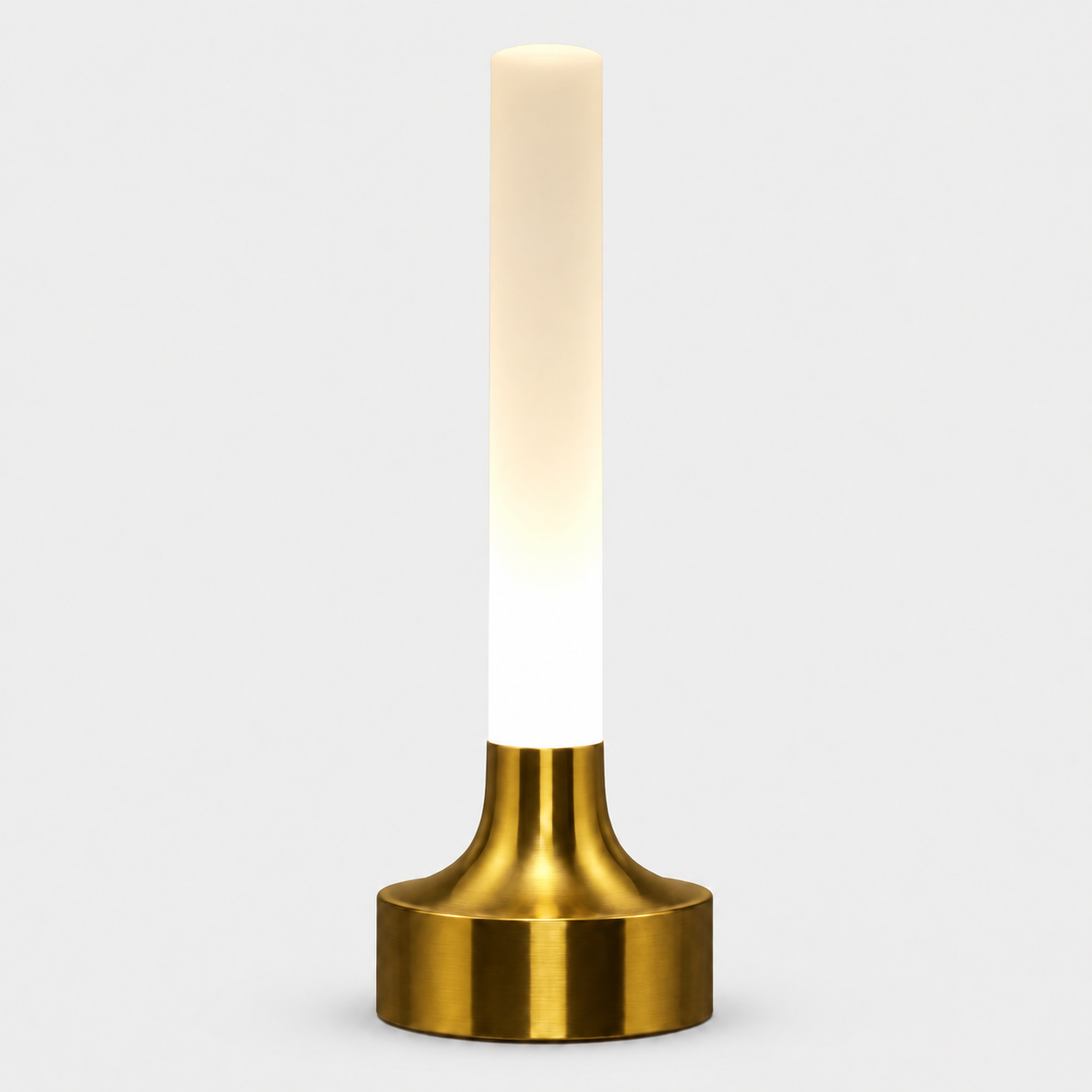 Tall gold table lamp with a slim white illuminated shade on a plain background.