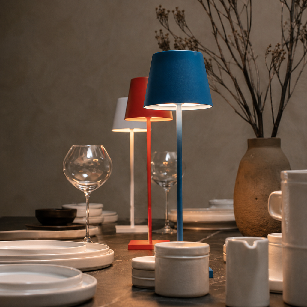 red and blue rechargeable table lamps grouped on a styled dining table