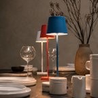red and blue rechargeable table lamps grouped on a styled dining table