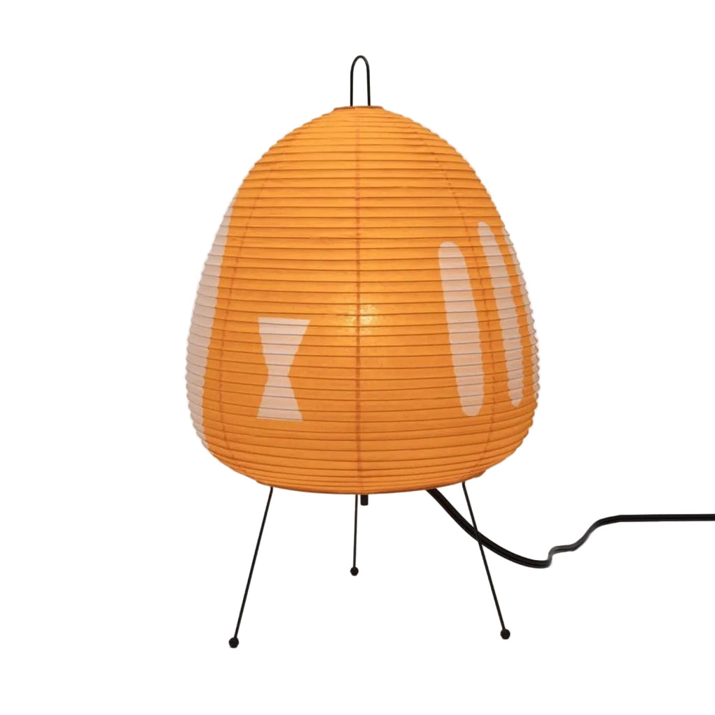Table lamp with an orange geometric shade isolated on white.