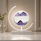 Purple quicksand table lamp with a white frame glowing in a warm greige setting.