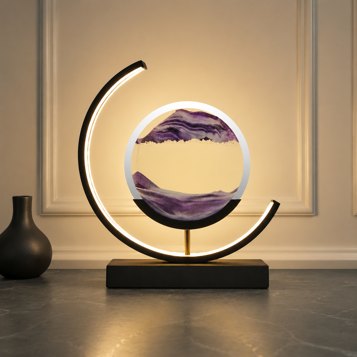 Purple quicksand table lamp with a black frame glowing against cream wall trim.
