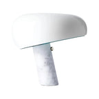 White table lamp with a rounded shade and veined marble base.