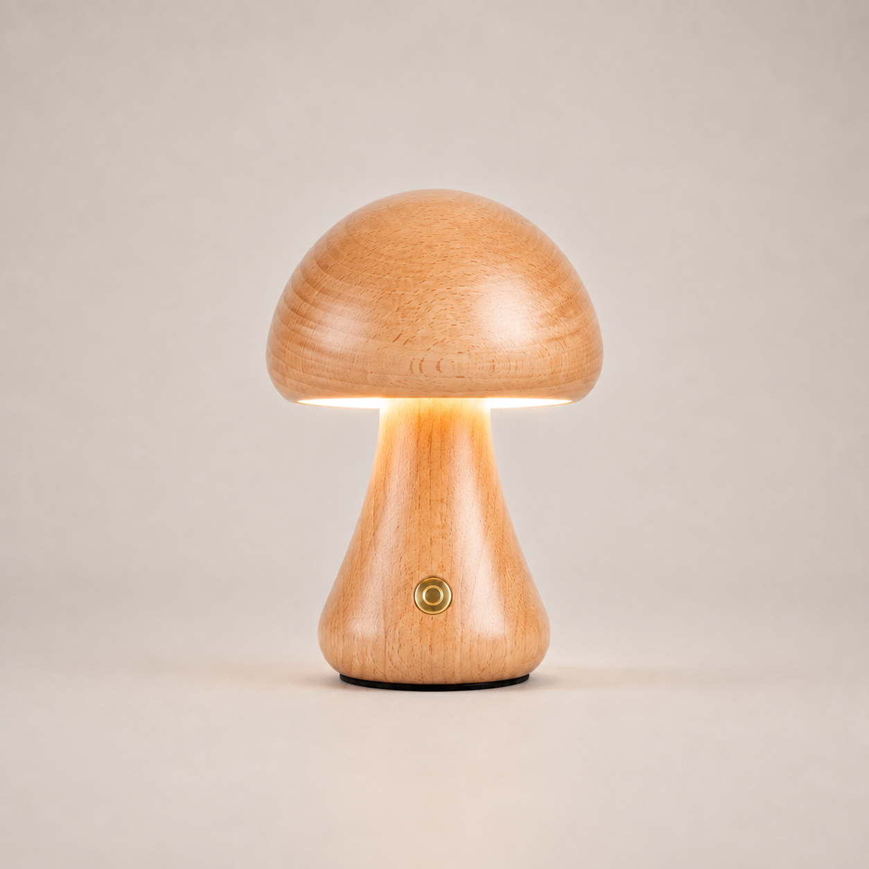 Table lamp with a rounded amber dome shade and flared triangular base on a light beige studio background.