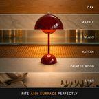 Red table lamp centered against wood and tiled backgrounds with three horizontal detail bands.