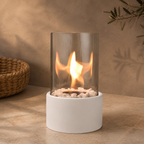 white tabletop fireplace burning on a warm neutral tabletop