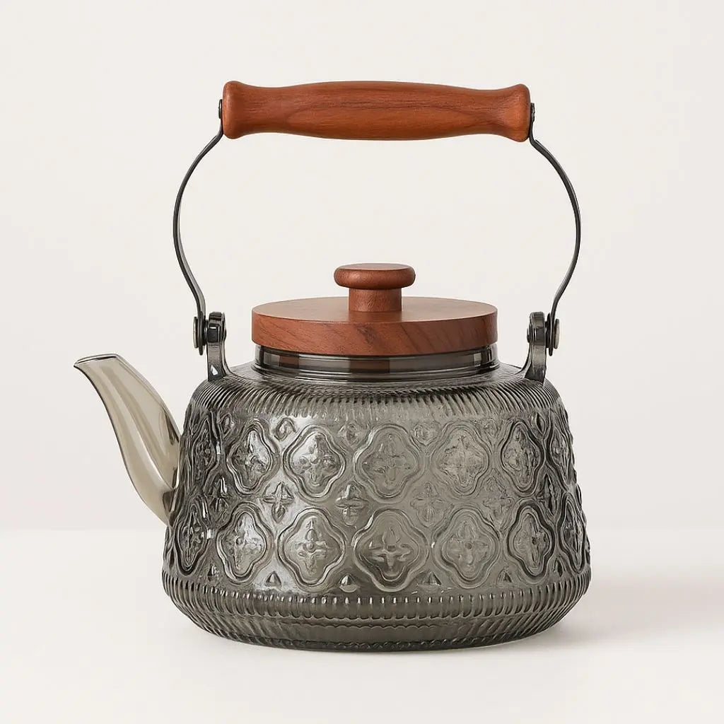 Patterned smoky gray glass teapot with wooden carry grip