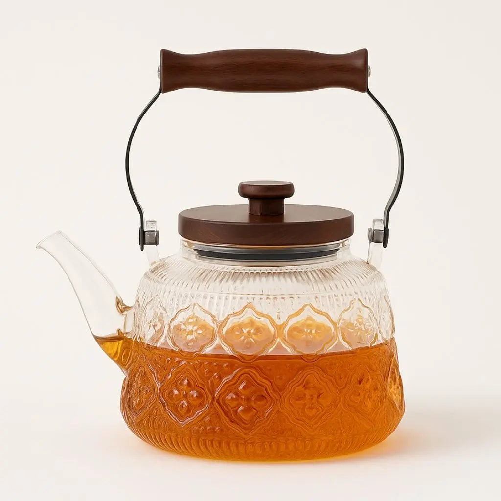Transparent patterned glass teapot with wooden carry grip