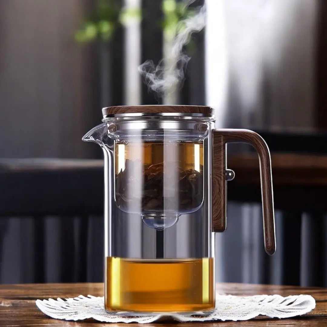 Clear glass teapot with an inner infusion chamber and wood look handle