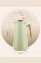 Thermal coffee carafe shown from the side with pouring spout.