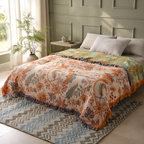 Boho floral throw blanket spread across a bed in a bright American bedroom