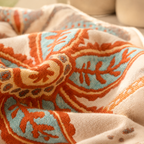 Boho floral throw blanket close up showing the detailed woven leaf pattern
