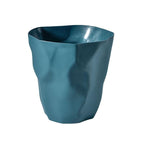 Trash can in navy blue isolated on a white background.
