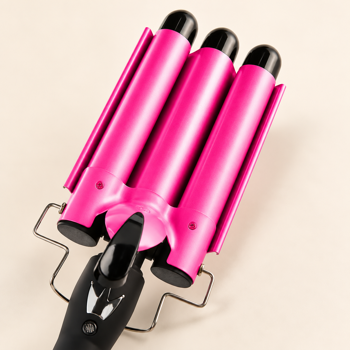 Pink triple barrel hair waver with a black handle and cool touch tips