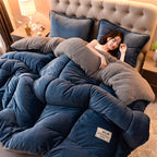 Blue plush comforter wrapped around a woman