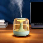 Green humidifier with amber lighting beside a laptop