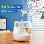 Water being poured into the open 650 mL humidifier tank