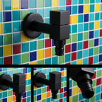 Wall-mounted faucet shown as several square matte black styles on mosaic tile.