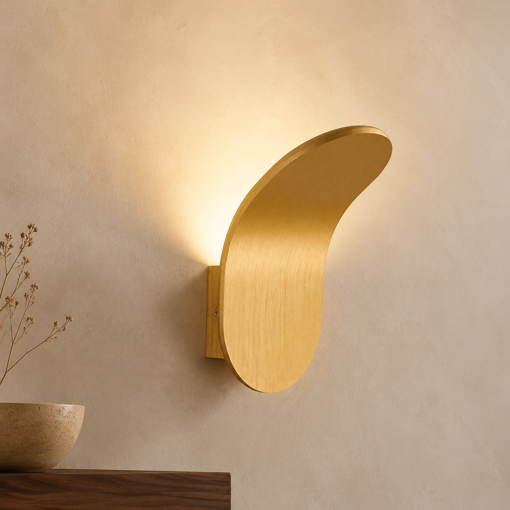Two black curved wall sconces casting warm light in a modern bedroom.