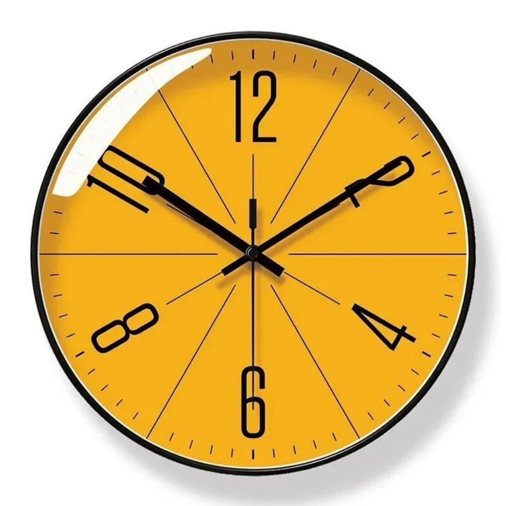 Black frame wall clock with orange analog dial.
