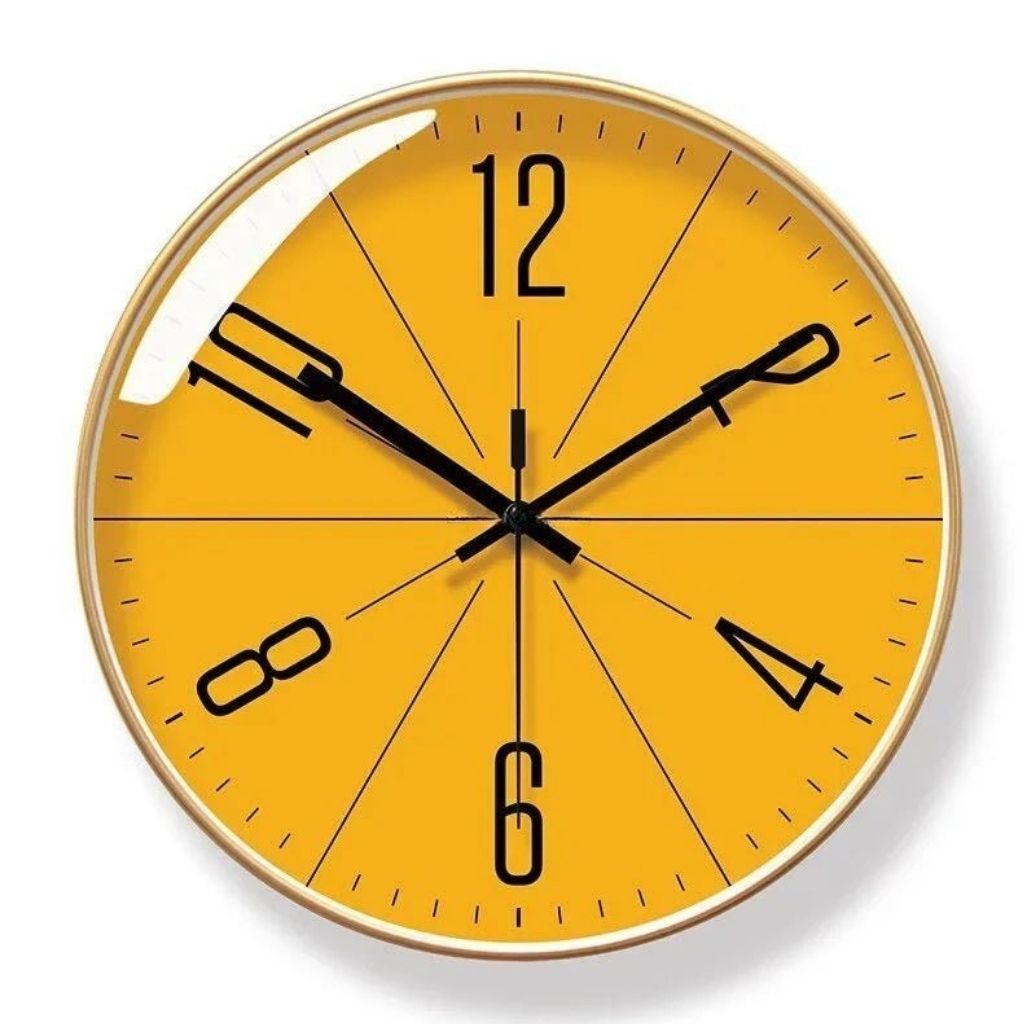 Gold frame wall clock with orange analog dial.