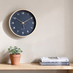 Wall clock detail showing the minimalist face design.
