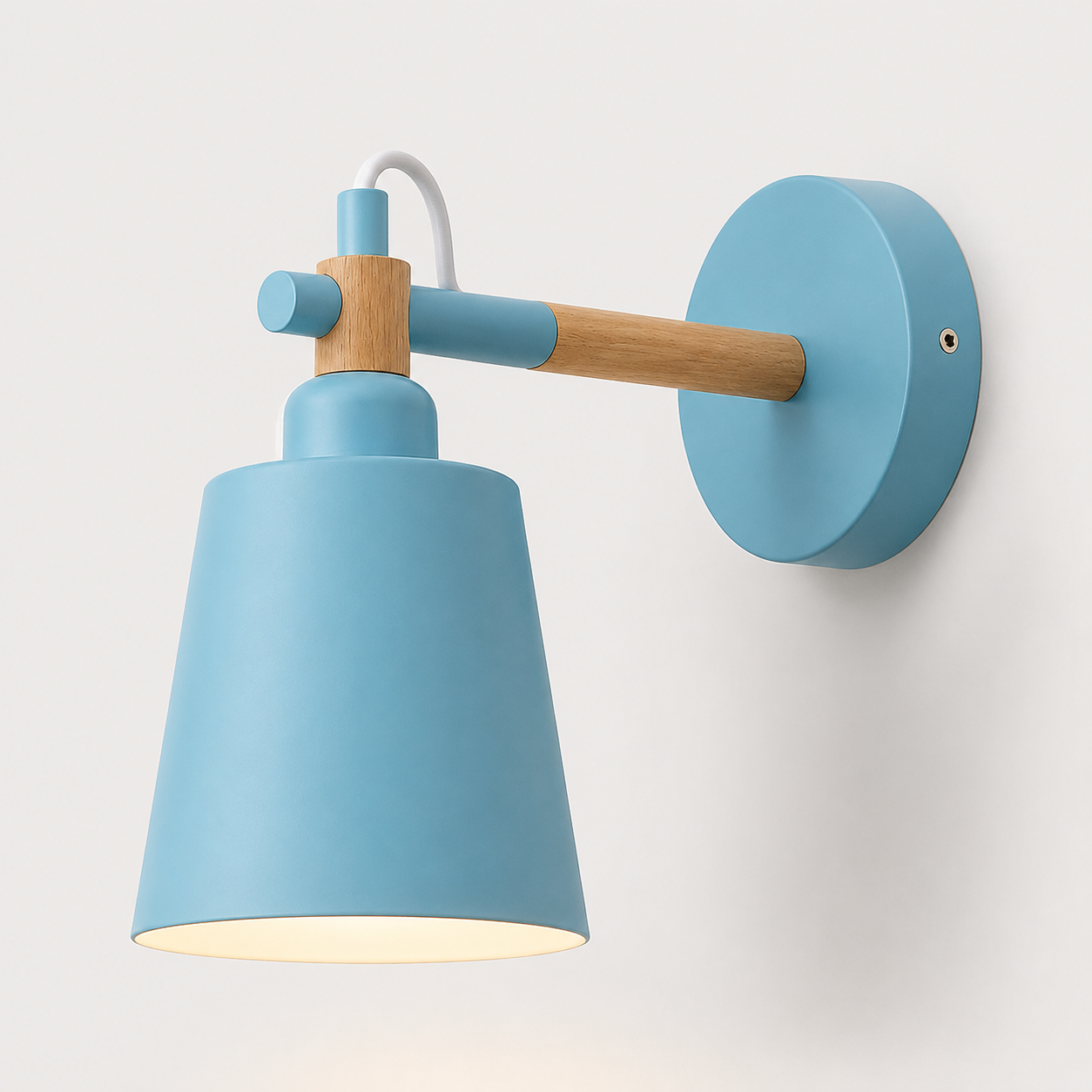 Scandinavian cone LED wall lamp with a solid wood arm, glowing warm white against a neutral wall.