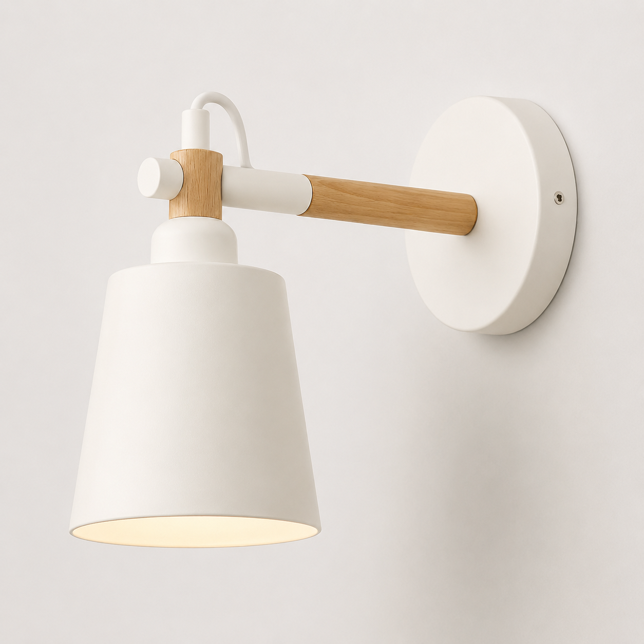 Scandinavian cone LED wall lamp with a solid wood arm, glowing warm white against a neutral wall.