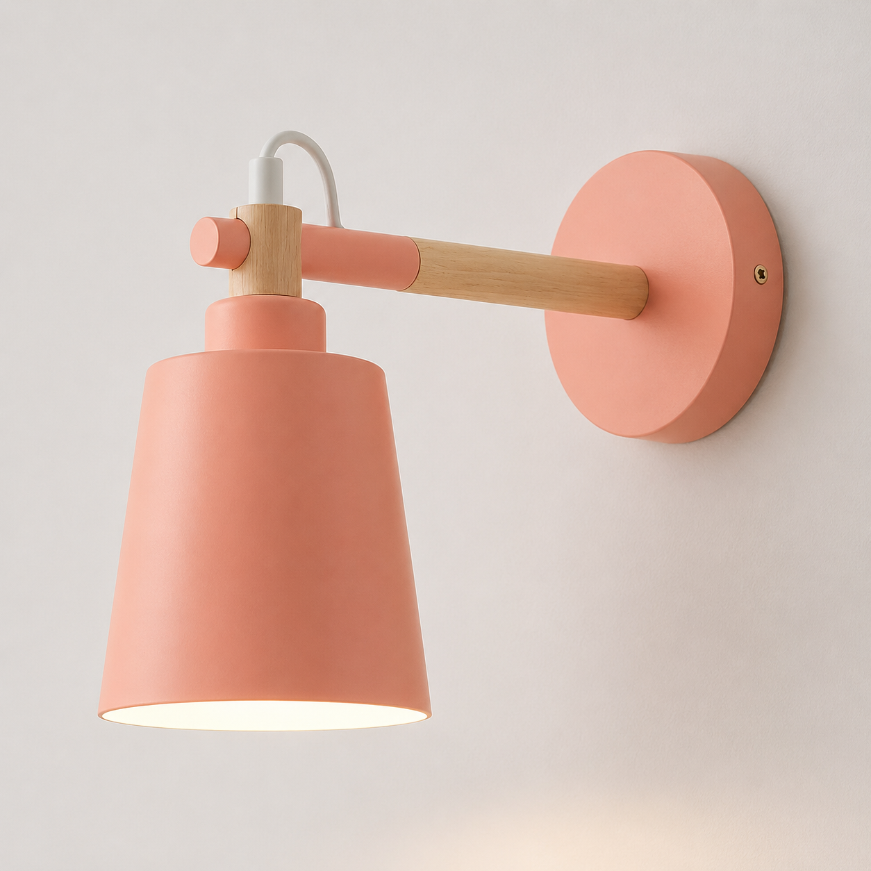 Scandinavian cone LED wall lamp with a solid wood arm, glowing warm white against a neutral wall.