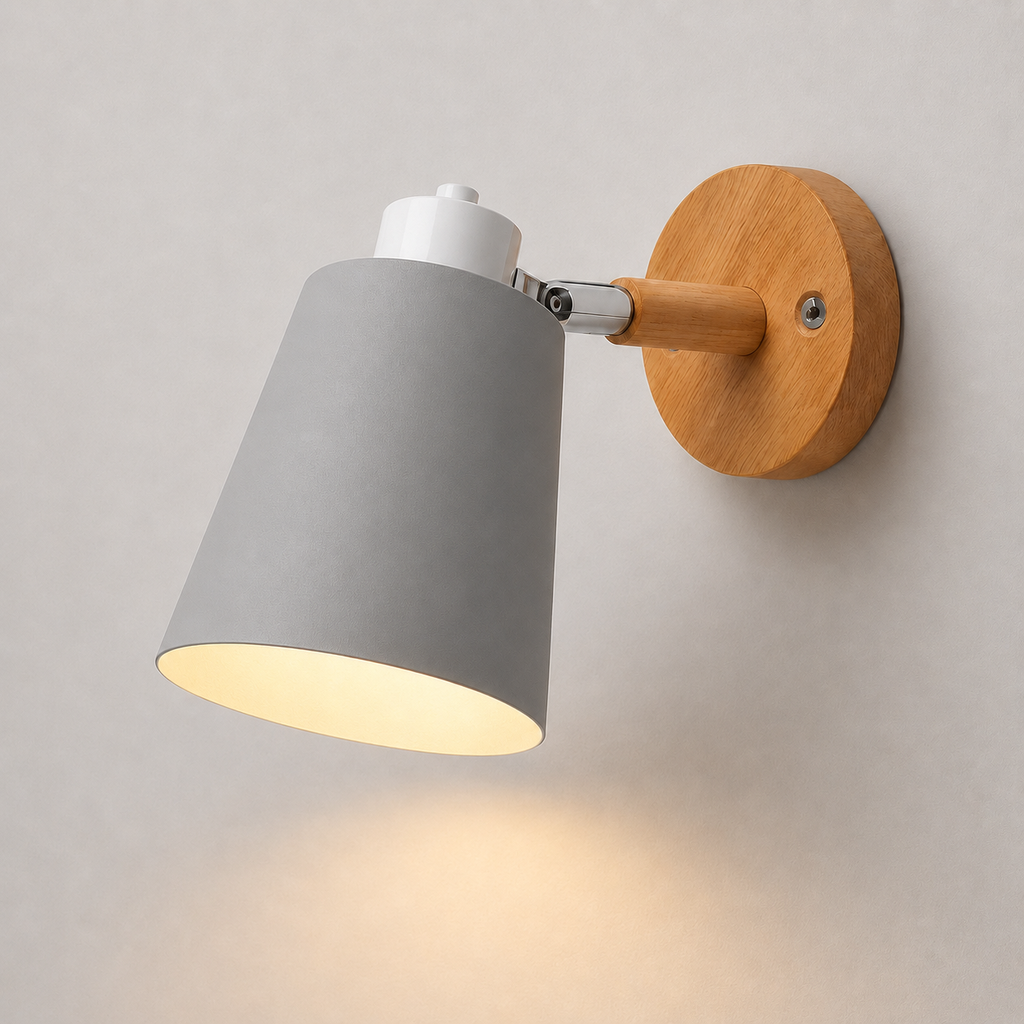 Adjustable cone wall lamp with a solid wood mounting base, glowing warm white against a neutral wall. 
