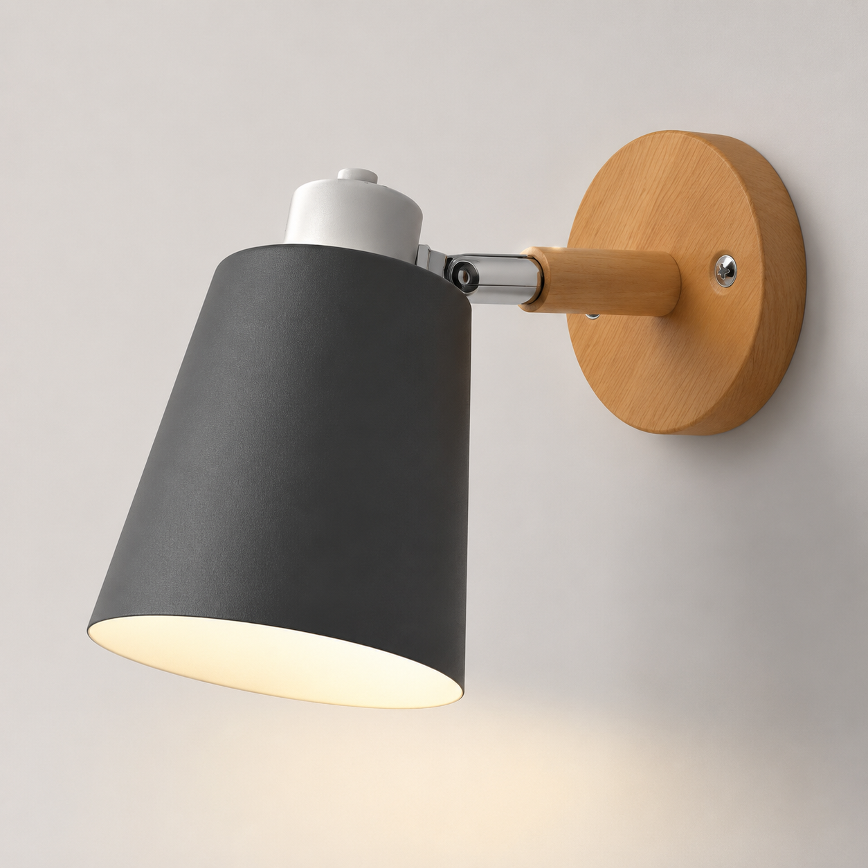 Adjustable cone wall lamp with a solid wood mounting base, glowing warm white against a neutral wall. 