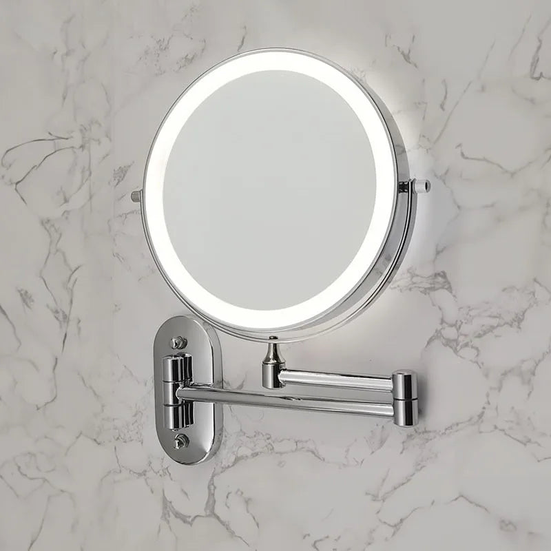 Folding arm magnifying wall mirror in bathroom