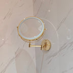 Gold wall mounted mirror folded toward the wall