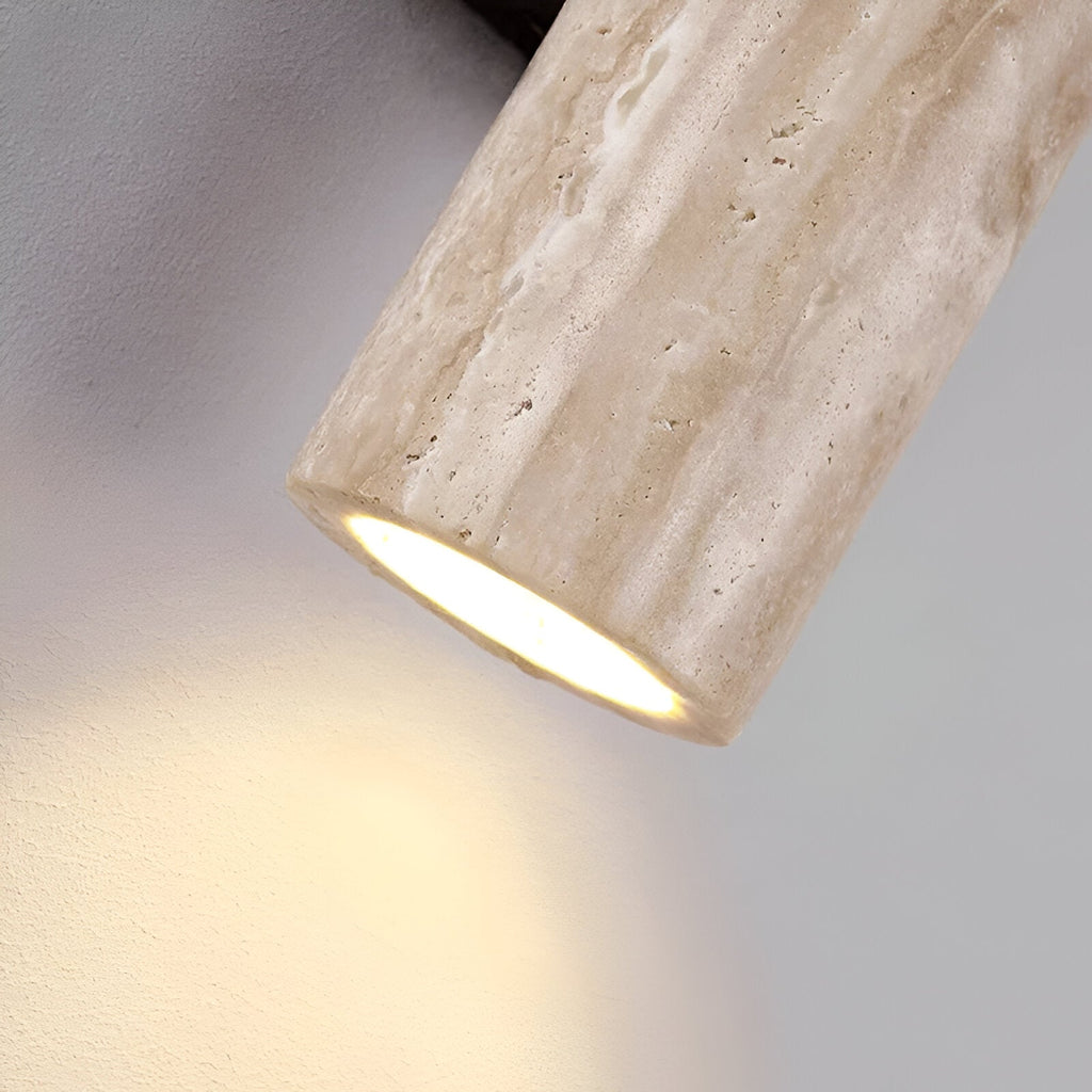 Wall sconce detail showing the open travertine shade