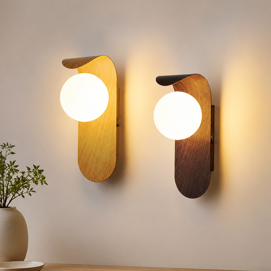 Light wood and walnut wall sconce pair glowing on a neutral wall.