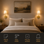 Pair of illuminated gold wall sconces beside a bed with installation feature icons.