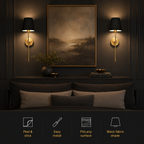 Pair of illuminated gold wall sconces with black shades mounted above bedside tables.