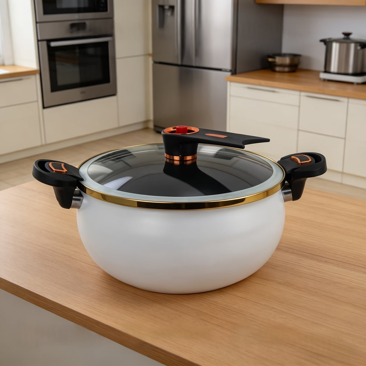 White enamel soup pot with glass lid on a kitchen counter