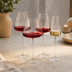Wine glasses collection filled with red and white wine on a stone table