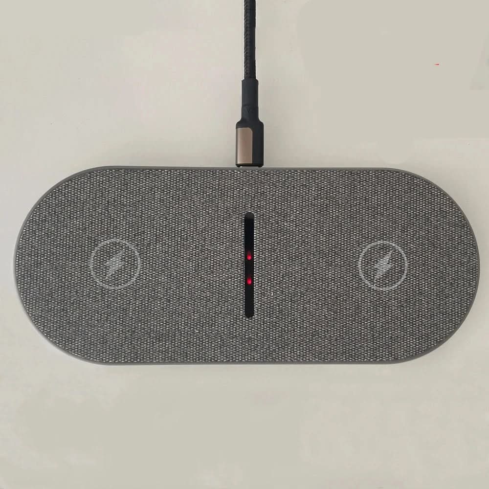 Dual wireless charging pad with two marked charging zones.