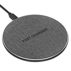 Round single wireless charging pad with attached power cable.