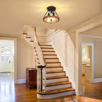 Wood and metal ceiling light above a staircase entrance