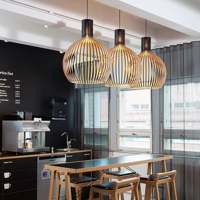 Wood pendant light arrangement shown above a cafe counter