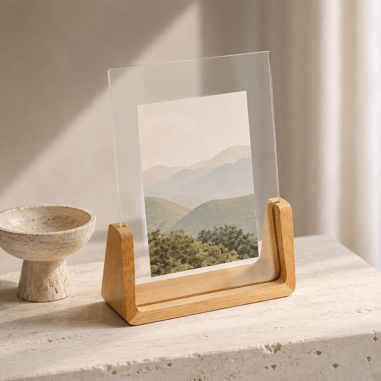 Vertical acrylic photo frame with pale wood base and a mountain landscape print.