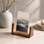 Vertical acrylic photo frame with walnut base and a layered mountain print.