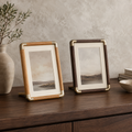 Teak and black walnut tabletop photo frames with brass tone corners