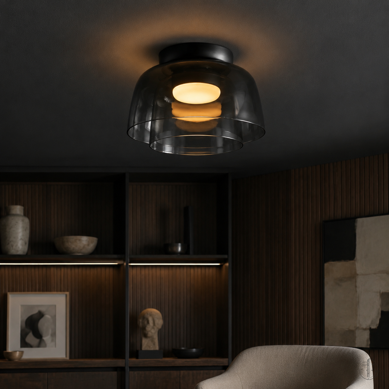 Smoke gray glass ceiling light against a dark interior.