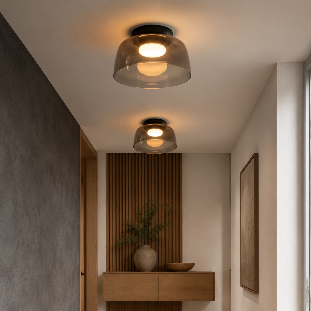 Smoke gray ceiling light in a dark architectural space.