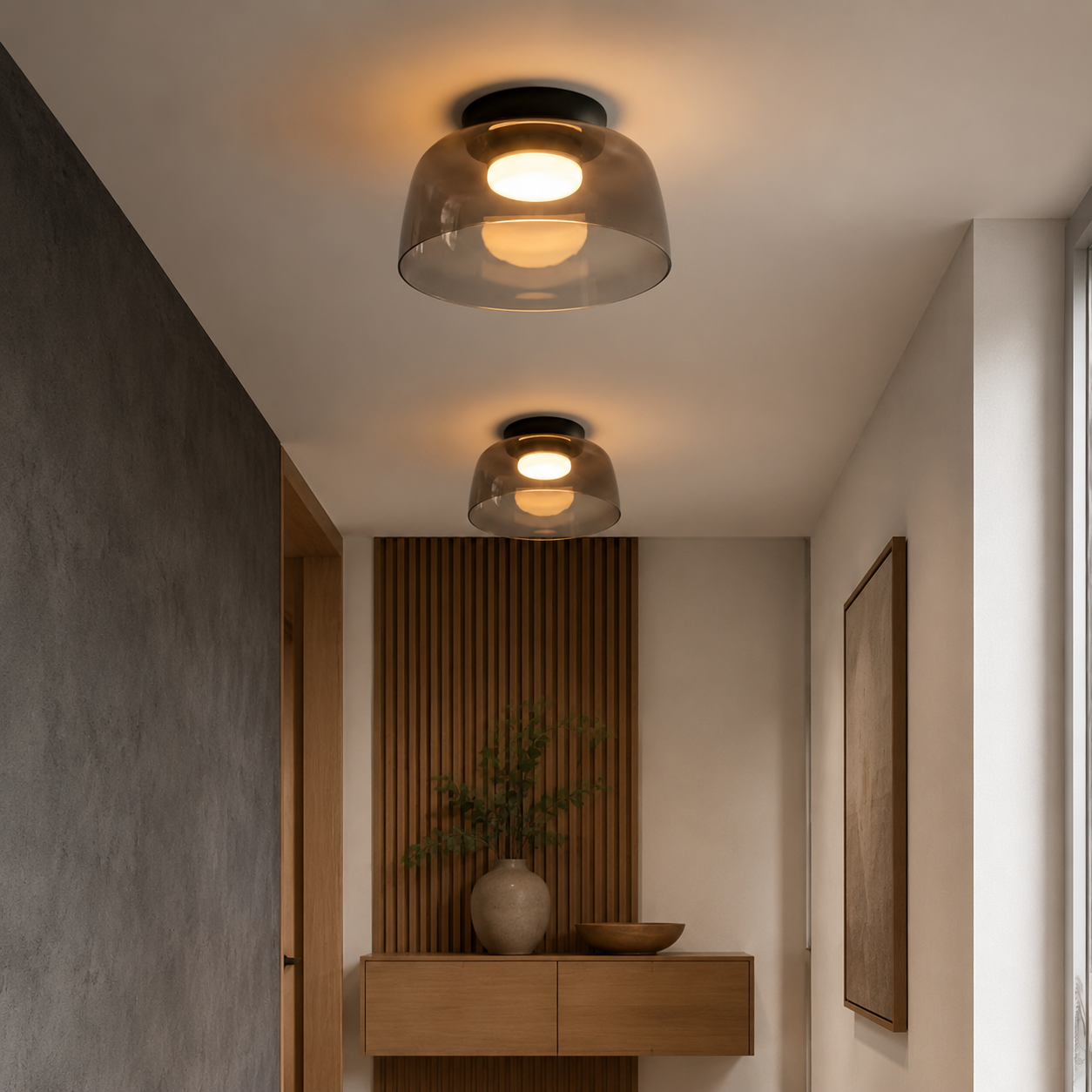 Smoke gray ceiling light in a dark architectural space.