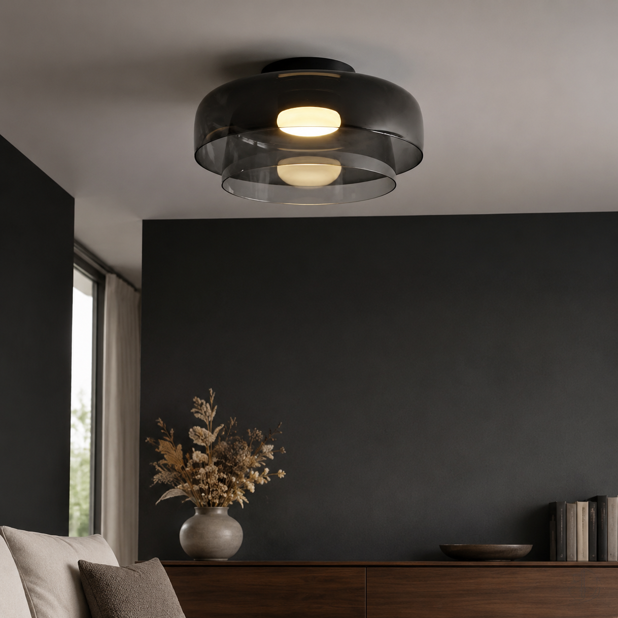 Smoke gray double-layer ceiling light against a charcoal wall.